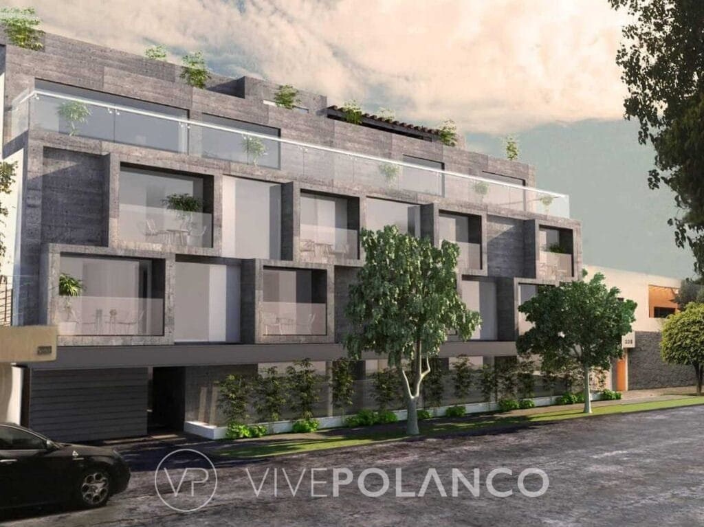 Fachada de edificio residencial contemporáneo de tres niveles con concreto aparente y balcones verdes en Goldsmith, Polanco
