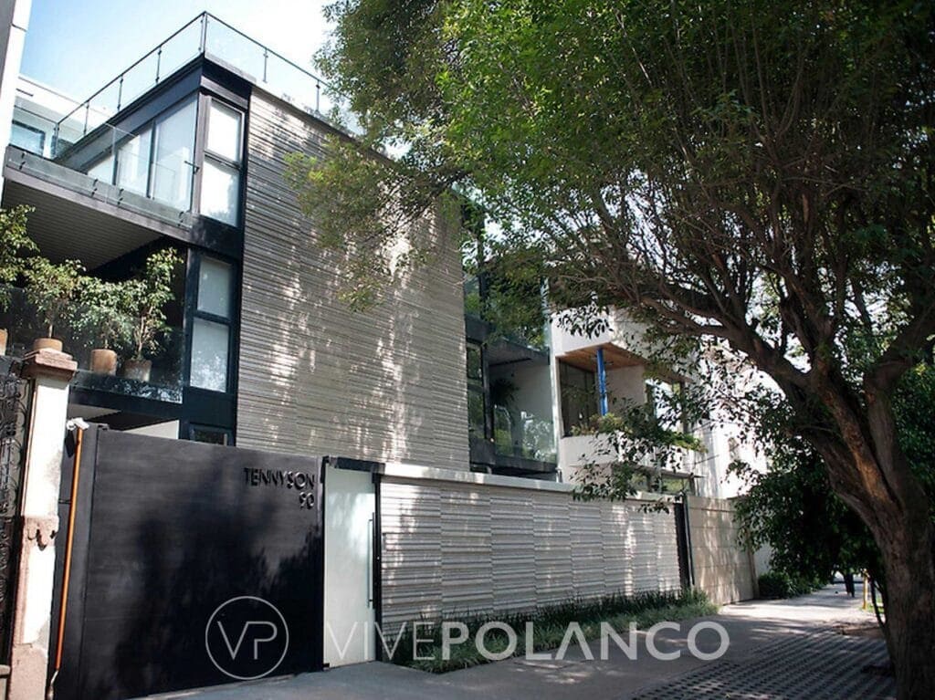 Fachada exterior de edificio residencial Tennyson con diseño contemporáneo y acabados grises