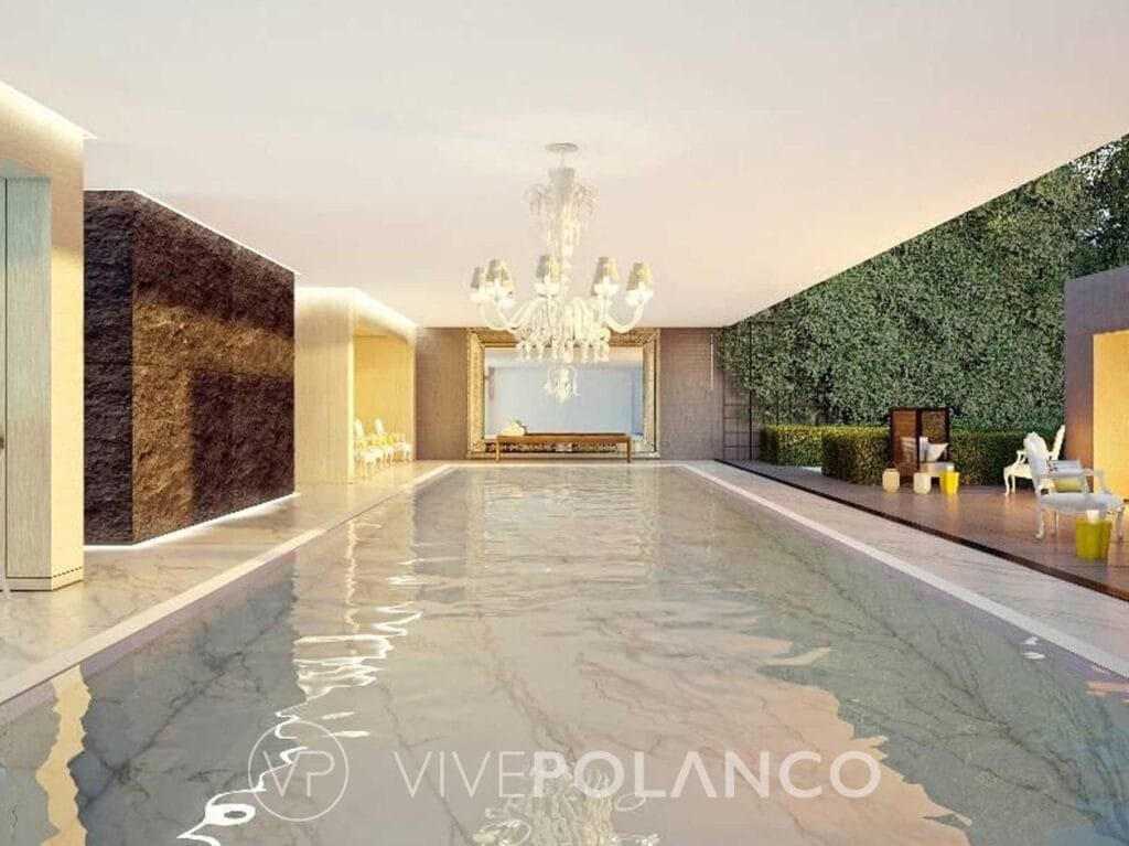 Alberca de Ruben Dario 225 con agua cristalina, muro verde, acabados de piedra y chandelier de cristal en Rubén Darío, Polanco