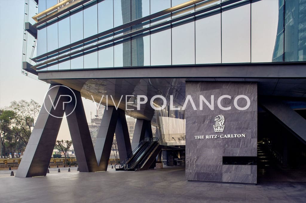 Modern exterior entrance of The Ritz-Carlton in Mexico City featuring reflective glass facade and distinctive architecture