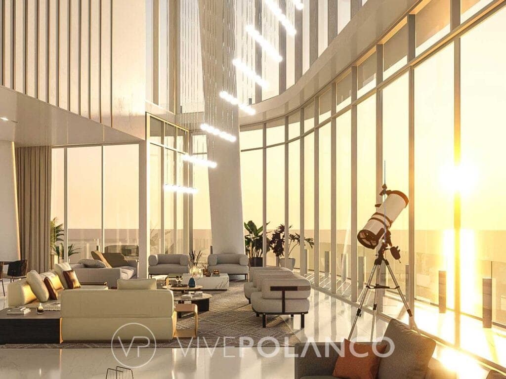 Amplia sala de estar de lujo en Aston Martin Residences Miami con ventanales de piso a techo y vista urbana en Aston Martin Miami, Polanco
