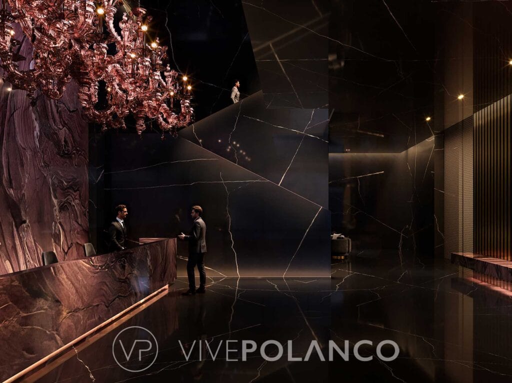 Lobby elegante de 888 Brickell Miami con recepción de mármol negro, chandelier de cobre y diseño contemporáneo