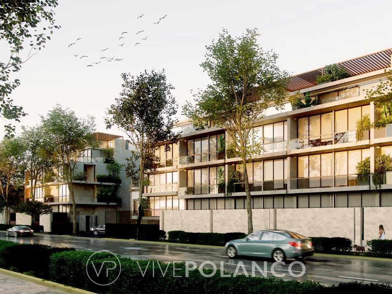 Fachada de edificio residencial moderno con balcones verdes y ventanales amplios en calle arbolada