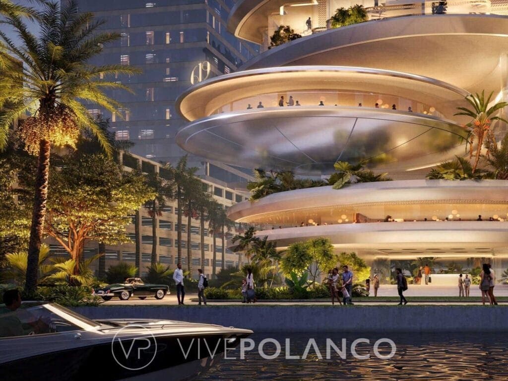 Render nocturno de 619 Brickell mostrando balcones curvos con jardines, palmeras y ambiente tropical