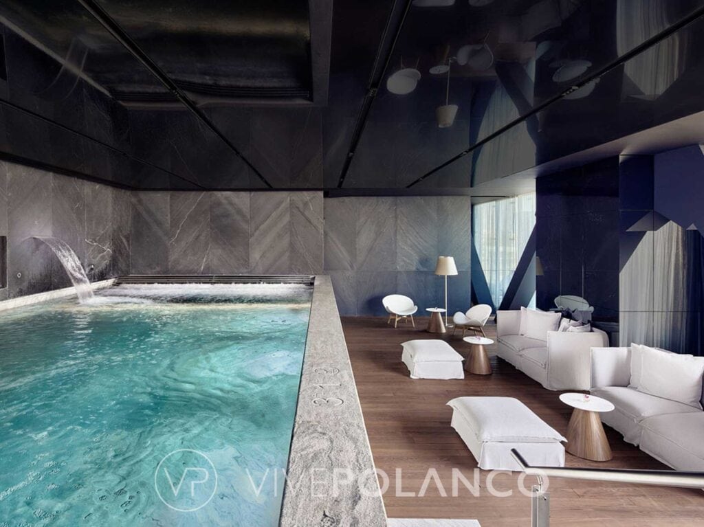 Floor-to-ceiling glass facade of The Ritz-Carlton Residences Mexico City overlooking Bosque de Chapultepec